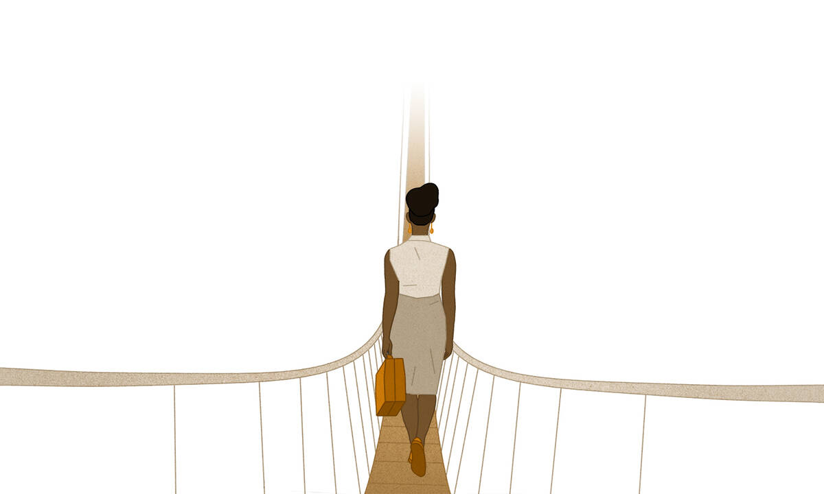 woman crossing rope bridge