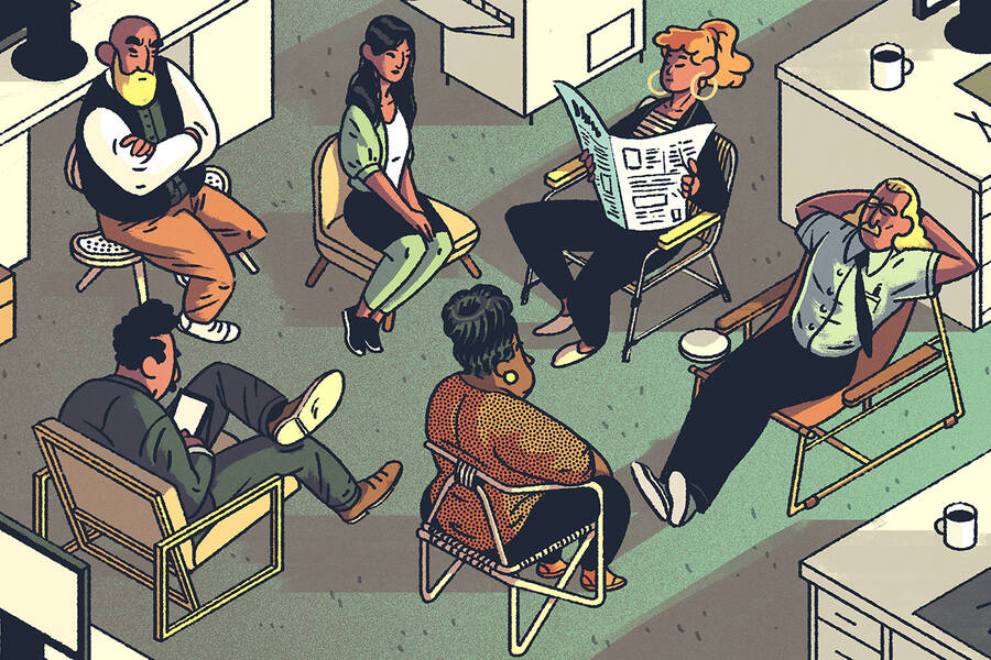 A group of coworkers sit in various chairs.