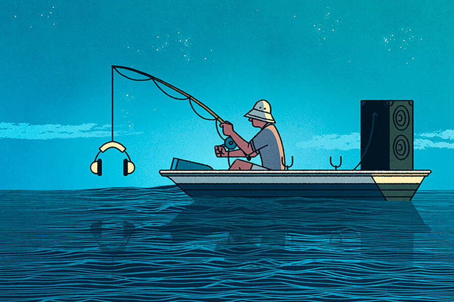 A fisherman reels in a pair of stereo headphones.