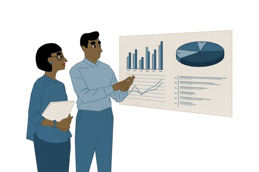 Members of a family business look over a spreadsheet.