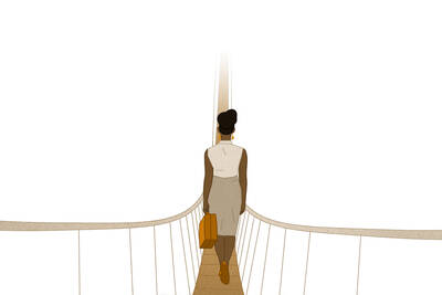 woman crossing rope bridge