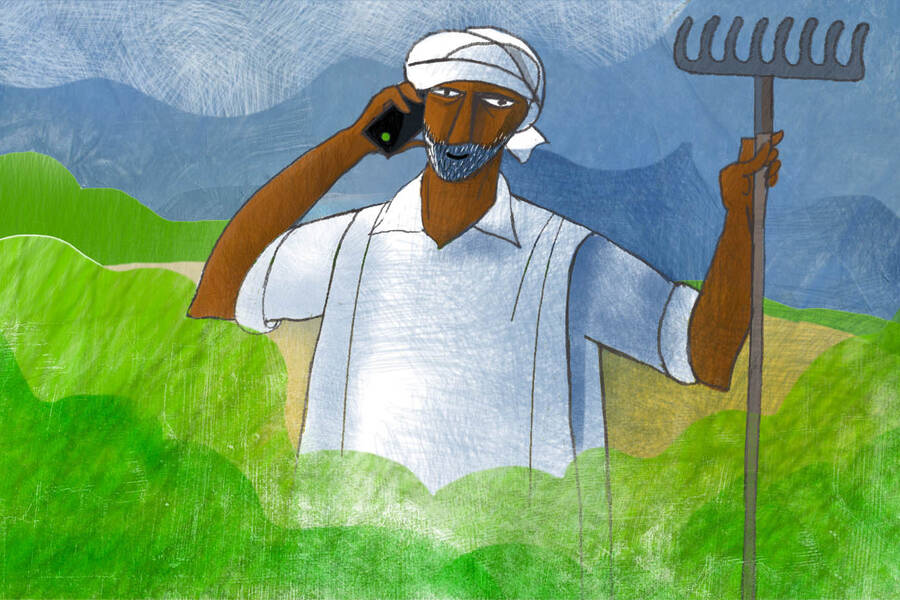 Indian farmer using cell phone