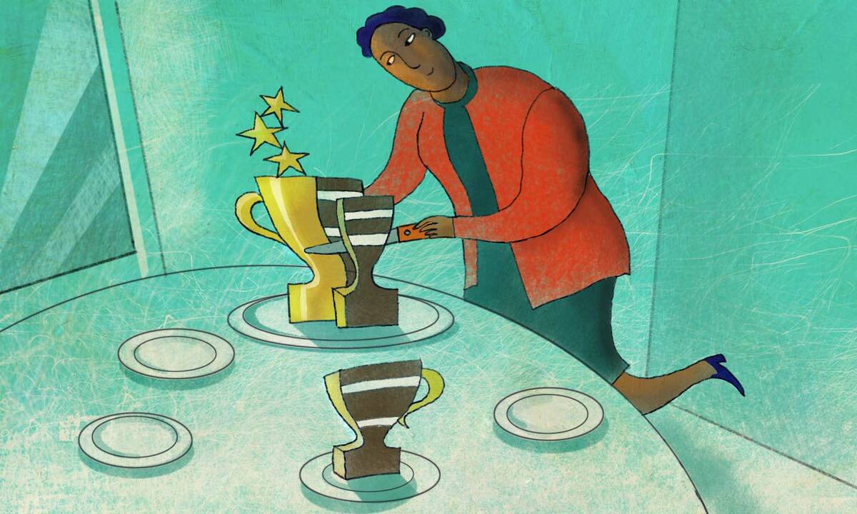 woman slices trophy-shaped cake