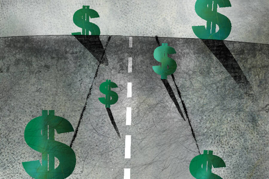 dollar signs stand on a road