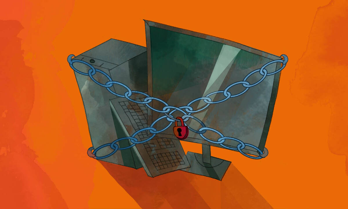 computer surrounded by chains and padlocks