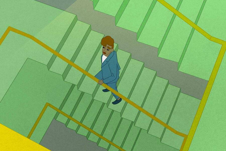 woman in blue suit ascending green staircase