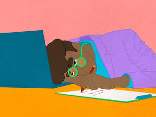 person putting head down on desk, writing, looking stressed out.