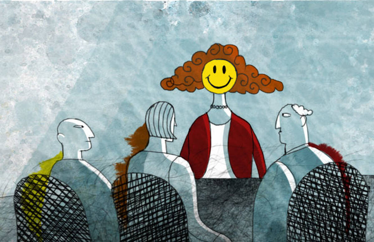A woman smiles in a business meeting.