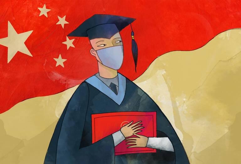 college graduate standing before Chinese flag