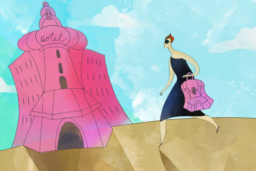 woman with pink hotel handbag entering pink hotel