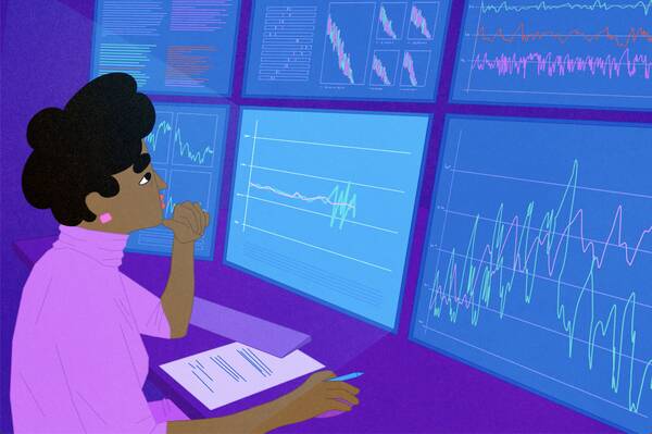 analyst sitting at desk watching stock volatility index