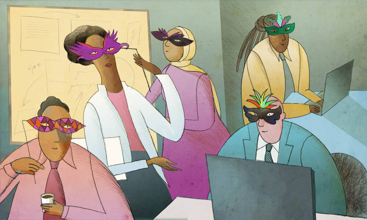 group of employees wearing mardi gras masks in office.