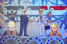illustration of auto factory where two executives are shaking hands on the assembly floor