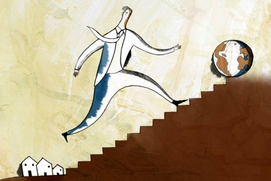 Businessman leaps up steps.
